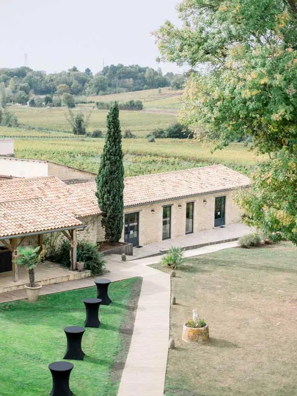 Outbuildings and vineyards of Château de Garde seen from above