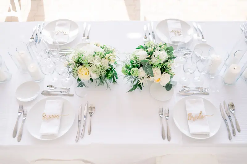 Wedding table with white flowers at Château de Seguin