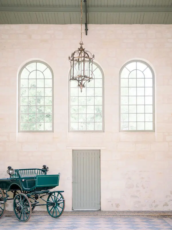 Antique horse-drawn carriage inside Château Gassies