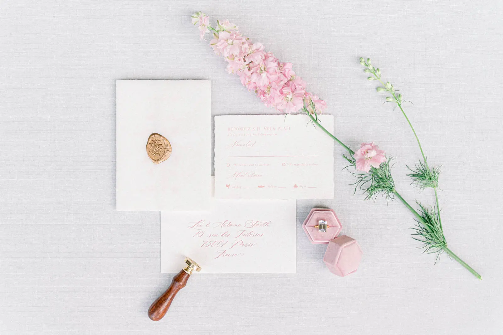 Wedding stationery with wax seal and pink flowers