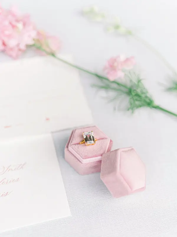 Pink ring box and spring flowers, wedding details