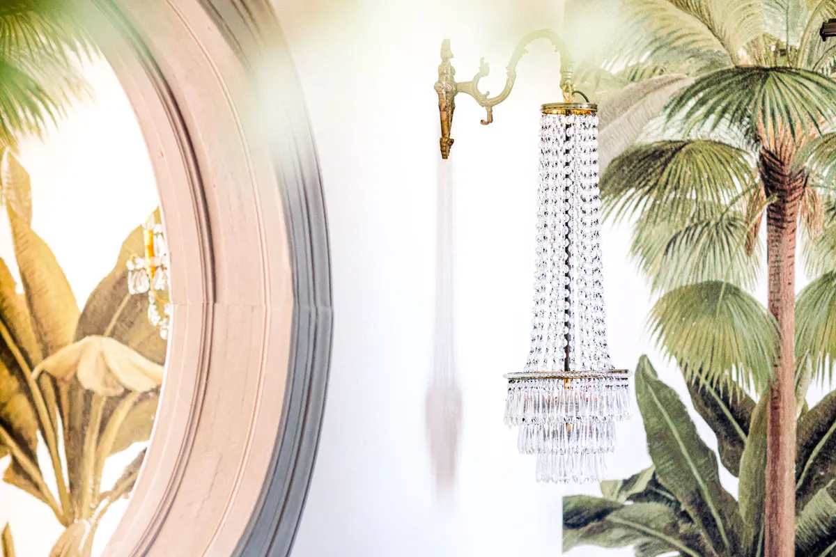 Crystal chandelier and tropical wallpaper, Château de Garde interior