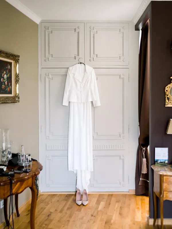Bridal outfit hanging in a room at Domaine de Larchey