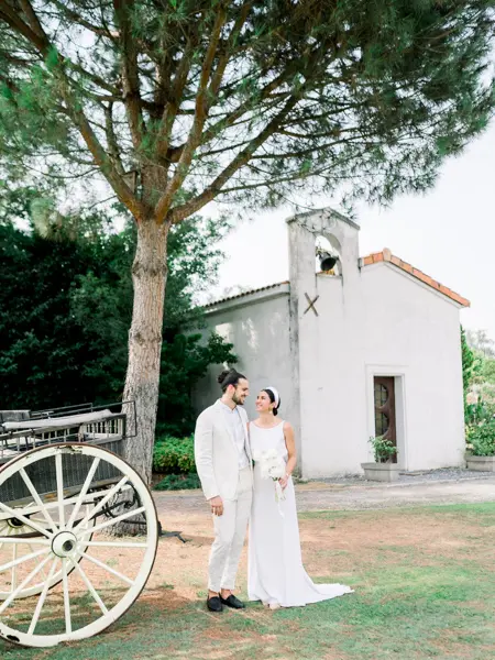Bride and groom by the Saint-Christophe chapel at Domaine de Larchey
