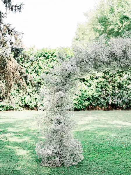 Gypsophila wedding arch in the gardens of Domaine de Larchey