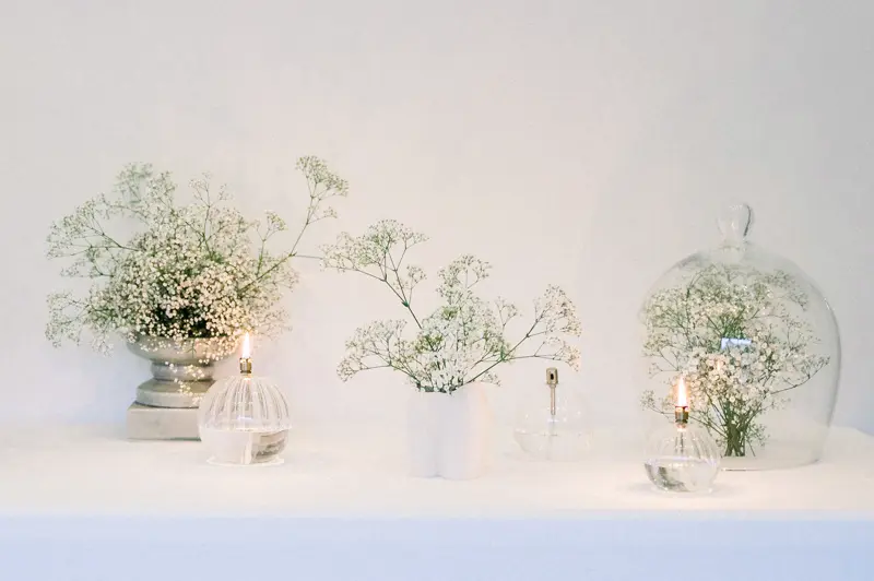 Wedding tables with gypsophila and candles at Domaine de Larchey