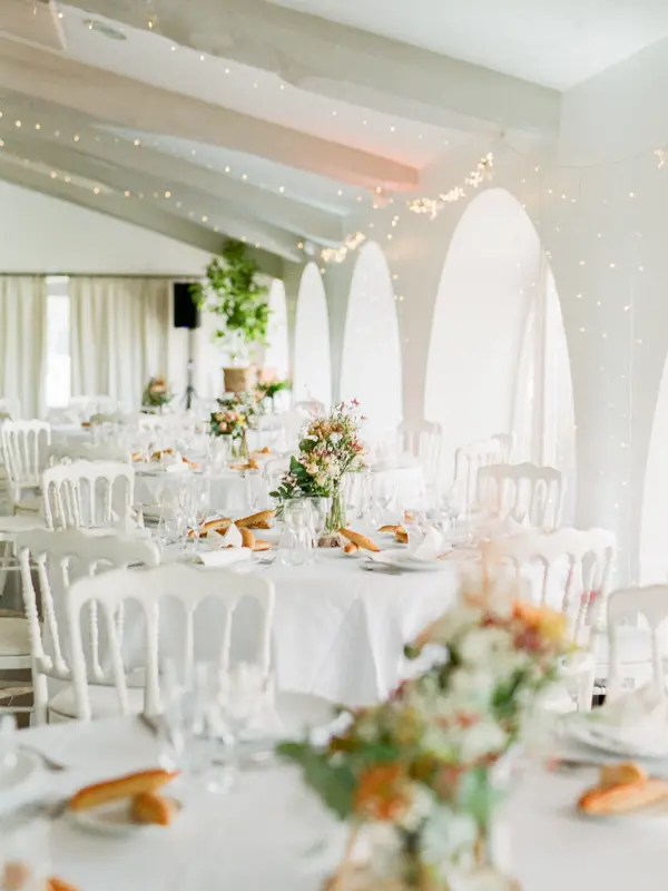 Aliénor reception room set for a wedding dinner at Domaine de Larchey