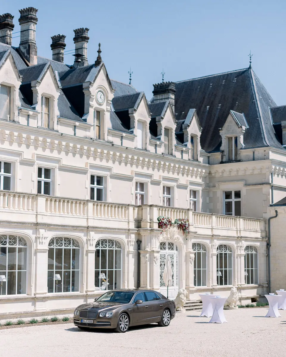 Façade of Château Gardemoulin near Cognac, with a luxury car at the entrance