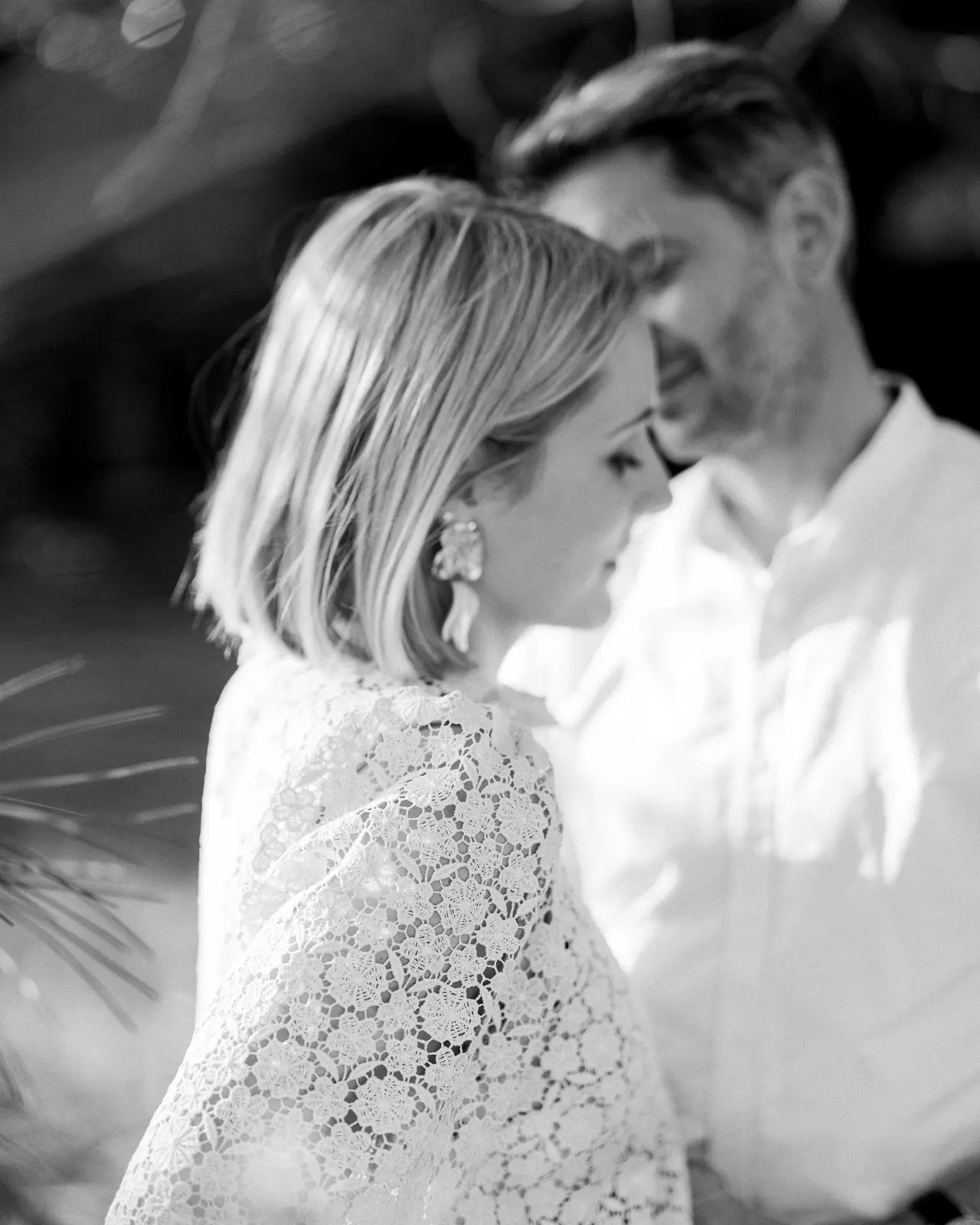 Couple resting foreheads together, black and white engagement session in Provence