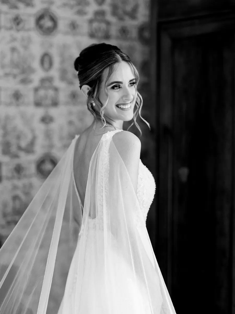 Black and white portrait of a bride with a long veil at Château Giscours